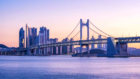 Timelapse-of-Gwangan-Bridge-and-Haeundae-at-Sunrise,-Busan-City,-South-Korea