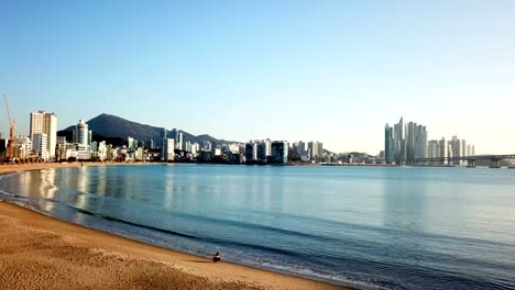 Gwangan-Bridge-and-Haeundae-aerial-view-at-Sunrise,-Busan,-South-Korea.