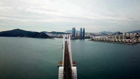 Gwangan-Bridge-and-Haeundae-aerial-view-at-Sunrise,-Busan,-South-Korea.