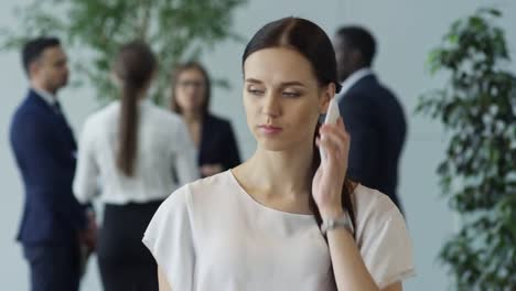 Cheerful-Businesswoman-Talking-on-Phone