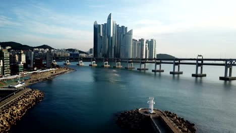 Gwangan-Bridge-and-Haeundae-aerial-view-at-Sunrise,-Busan,-South-Korea.