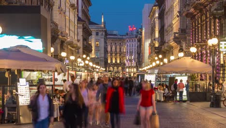 Italy-milan-city-night-illuminated-famous-crowded-dante-street-panorama-4k-timelapse