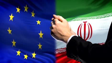 European-Union-sanctions-Iran,-chained-arms,-political-or-economic-conflict