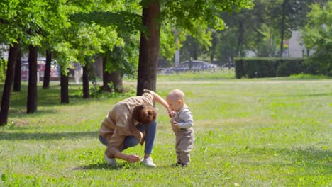 Mother-Caring-for-Coughing-Baby-in-Park