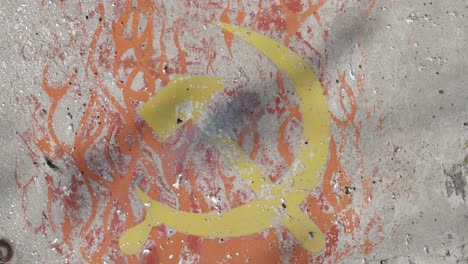 pan-of-a-soviet-hammer-and-sickle-painted-on-a-section-of-the-berlin-wall