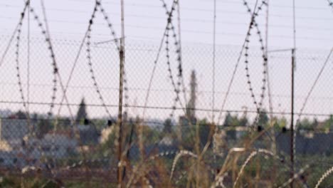 Border-fence-between-Israel-and-West-Bank.-barbed-wire-electronic-fence.