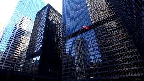 Canadian-flag-in-the-midst-of-skyscrapers