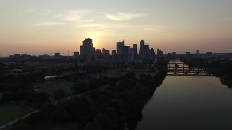 Aerial-view-of-sunset-sun-setting-over-Austin,-Texas,-USA