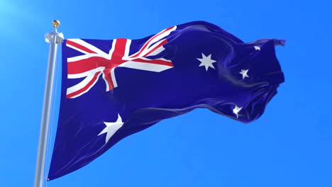 Flag-of-Australia-waving-at-wind-in-blue-sky,-loop