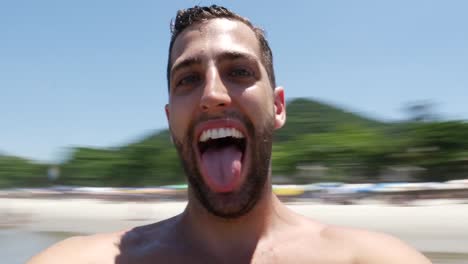 Man-on-vacation-laughing-at-the-beach