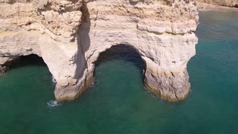 Flying-over-Praia-Da-Marinha-(Marinha-Beach)-in-Algarve,-Portugal