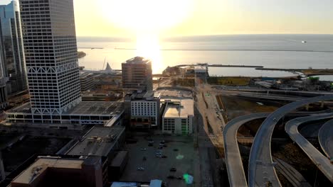 Aerial-view-of-american-city-at-dawn.-High-rise--buildings,-freeway,-bay.--Sunny-morning.-Milwaukee,-Wisconsin,-USA