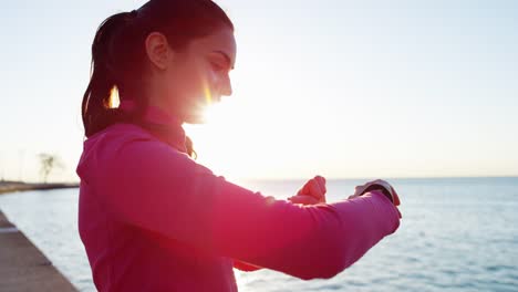 Hispanic-Caucasian-female-in-sun-flare-stretching-outdoors