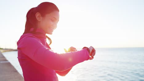 Hispanic-female-warm-up-stretching-in-sun-flare