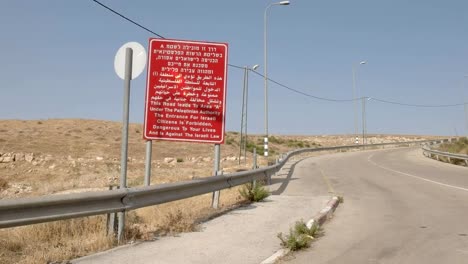 zoom-in-shot-of-an-entry-sign-to-the-palestinian-territory