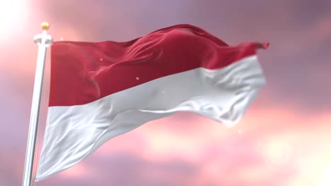 Flag-of-Indonesia-waving-at-wind-in-slow-at-sunset,-loop