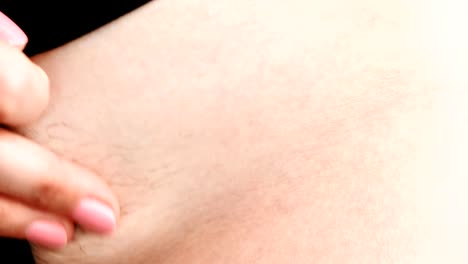 Not-shaved-close-up-of-pubic-hair-on-the-female-body-in-lingerie.-Women's-hands-you-scratch-your-pubes.