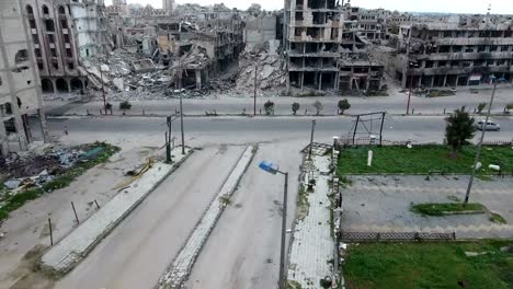 Aerial-view-over-a-road-in-Syria,-cars-in-background