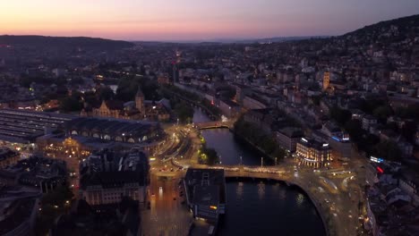 sunset-illuminated-zurich-city-center-riverside-aerial-panorama-4k-switzerland