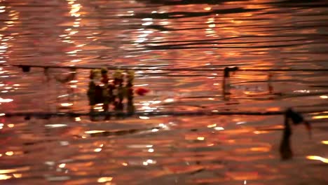 Beautiful-nighttime-colors-reflecting-off-of-the-Ganges:-Varanasi,-India