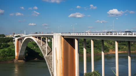 Timelapse-View-of-Friendship-Bridge-(Ponte-da-Amizade),-Connecting-Foz-do-Iguacu,-Brazil,-to-Ciudad-del-Este,-Paraguay
