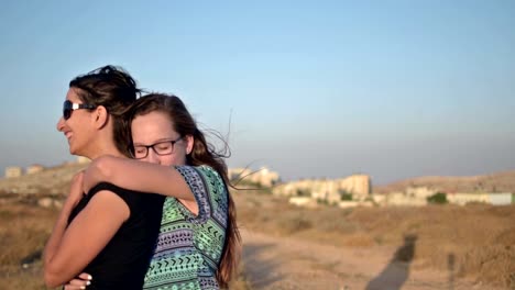 Happy-mother-with-her-teenage-daughter-outdoor