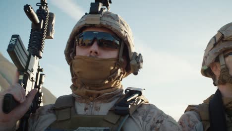 Close-up-Shot-Group-of-Fully-Equipped-Soldiers-Standing-in-a-Line-in-the-Desert.