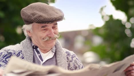 Old-happy-man-reading-papers