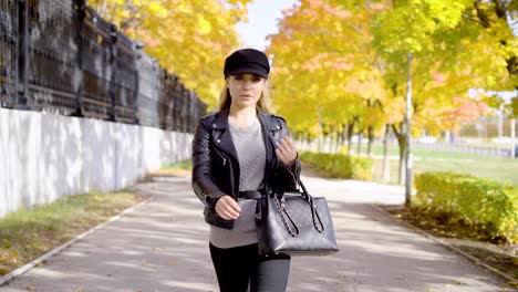 Charming-woman-is-spending-some-time-walking-on-an-alley