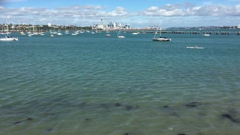 Person-Kayaking-against-Auckland-skyline