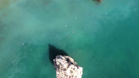 Flying-over-Praia-Da-Marinha-(Marinha-Beach)-in-Algarve,-Portugal