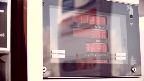 Display-for-petrol.-The-driver-pumping-gasoline-at-the-gas-station.