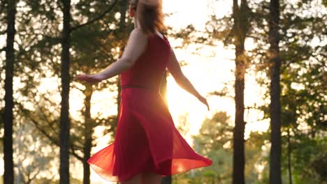 Happy-smiling-woman-in-red-dress-with-transparent-skirt-dancing-and-turning-around