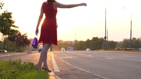 Woman-in-red-dress-hitchhike-on-road,-make-long-arm,-car-drive