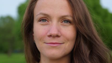 Smiling-face-of-brunette-woman-close-up.