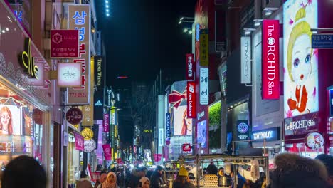 Timelapse-at-Myeong-dong-Market.People-walking-on-a-shopping-street-at-night,-Seoul,-South-Korea