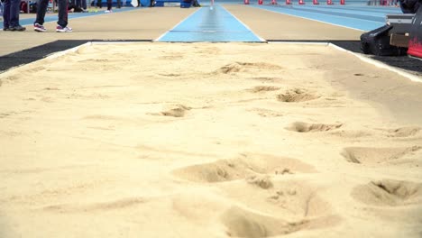 Athlete-practicing-high-jump-at-sports-venue-4k