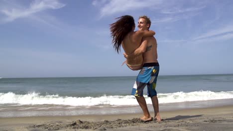 SLOW-MOTION:-Man-carrying-and-spinning-his-girlfriend