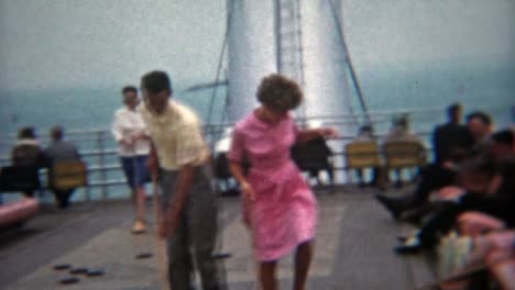 1964:-Teenagers-in-love-playing-shuffleboard-on-a-ship-together.