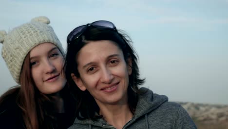 Family-portrait-of-happy-mother-and-teenage-daughter-smiling,-hugging,-showing-love-footage.