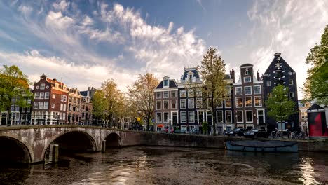 Amsterdam-city-skyline-sunset-timelapse-at-canal-waterfront,-Amsterdam,-Netherlands,-4K-Time-Lapse
