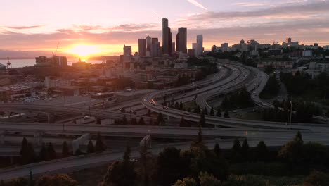 Rising-Aerial-of-Golden-Hour-Sunset-on-Downtown-Cityscape-in-Pacific-Northwest