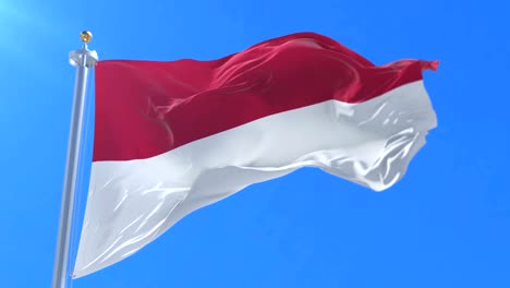 Bandera-de-Indonesia-ondeando-al-viento-en-lento-en-cielo-azul,-lazo