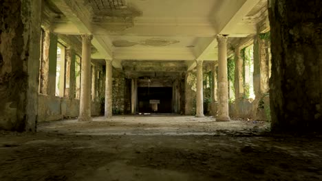 Walking-in-the-abandoned-building-in-Tskaltubo,-Georgia