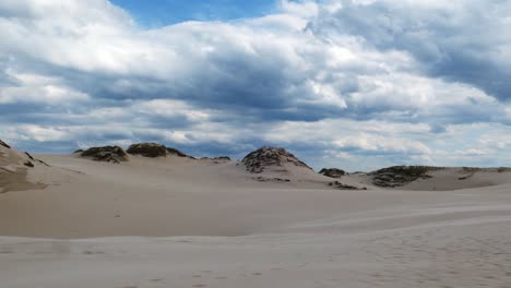 Timelapse-of-Sandy-Desert-and-Dark-Storm-Clouds