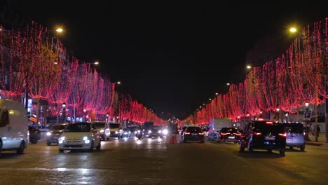 Zoom-in-at-night-to-Avenue-des-Champs-Élysées-illuminated-by-lights-of-Christmas