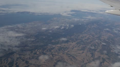 Aerial-view-of-San-Francisco-and-Oakland-Suburbs-out-of-plane-window-4k