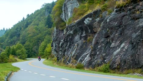 Motorcycle-Passing-Stone-Wall-on-Blue-Ridge-Parkway
