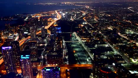 Autos,-trains-and-planes-at-night-in-Toronto,-Canada