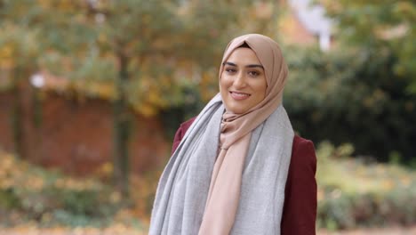 Portrait-Of-British-Muslim-Woman-In-Urban-Park